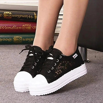 Mandotos women's canvas shoes featuring a casual, stylish design with white laces and a comfortable flat sole.