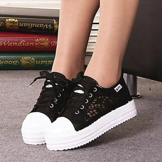 Mandotos women's canvas shoes featuring a casual, stylish design with white laces and a comfortable flat sole.