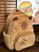 Mandotos Capybara Cuddle Backpack featuring a soft plush design and realistic capybara face for cute, cozy carrying.