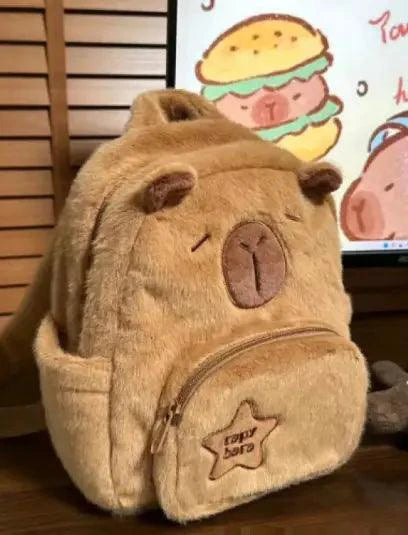 Mandotos Capybara Cuddle Backpack featuring a soft plush design and realistic capybara face for cute, cozy carrying.