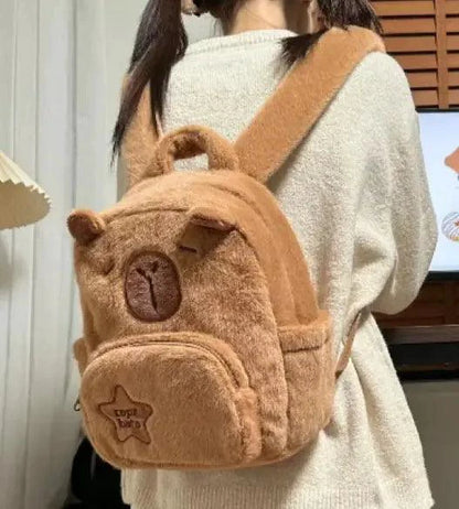 Mandotos Capybara Cuddle Backpack featuring a soft, plush capybara design with adjustable straps and cute facial details.
