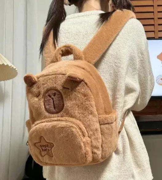 Mandotos Capybara Cuddle Backpack featuring a soft, plush capybara design with adjustable straps and cute facial details.