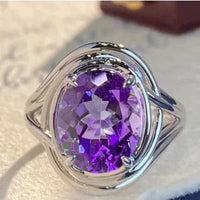 Elegant amethyst copper ring by MANDOTOS featuring a polished purple gemstone and intricate copper band design.