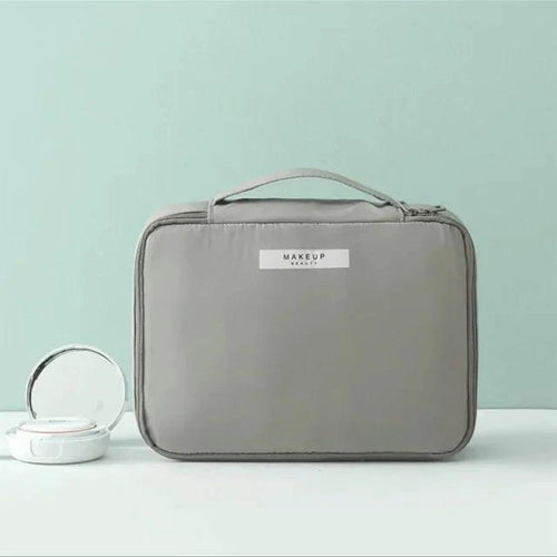 Mandotos Chic Beauty Bag Organizer with multiple compartments for cosmetics and toiletries, in sleek black material.