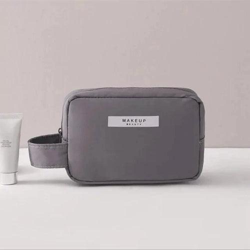 Mandotos Chic Beauty Bag Organizer with multiple compartments for cosmetics and toiletries, compact and stylish for travel.