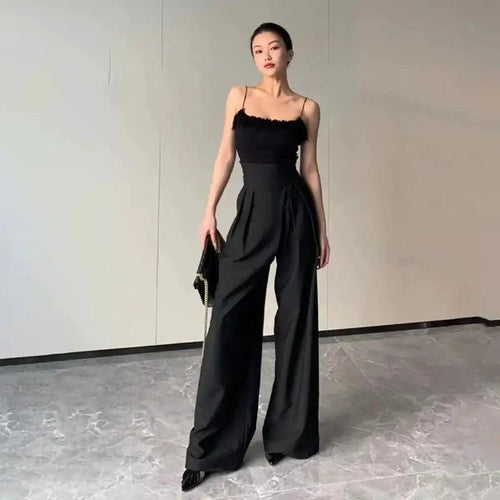 Mandotos chic flowy wide-leg trousers with a relaxed fit and lightweight fabric, perfect for casual or stylish outfits.