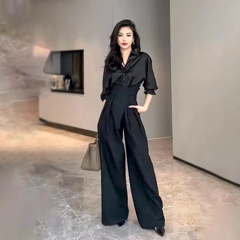 Mandotos chic flowy wide-leg trousers, lightweight fabric, high waist, and relaxed fit, perfect for stylish casual wear.