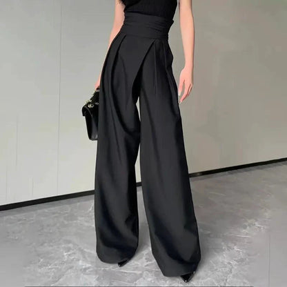 Mandotos chic flowy wide-leg trousers shown in a relaxed fit with smooth fabric and a stylish, modern silhouette.
