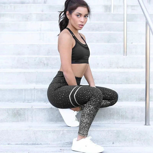 Mandotos chic gold print leggings featuring a stylish gold pattern on black fabric, close-up view of the vibrant design.