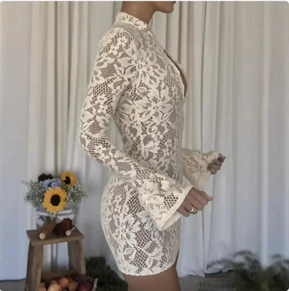 Mandotos chic hollow-out bell sleeve dress featuring stylish cutouts and flowing fabric, perfect for elegant occasions.