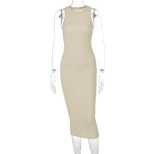 Mandotos chic knitted tank sweater dress featuring a fitted silhouette and cozy, stylish design in neutral tones.