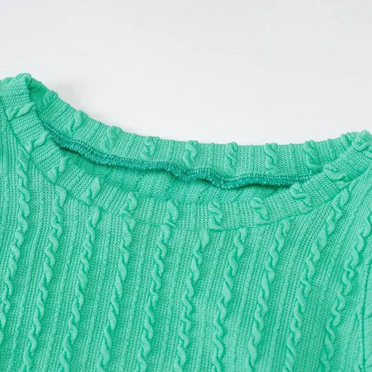 Mandotos chic knitted tank sweater dress featuring a fitted design and cozy texture, perfect for casual or layered outfits.