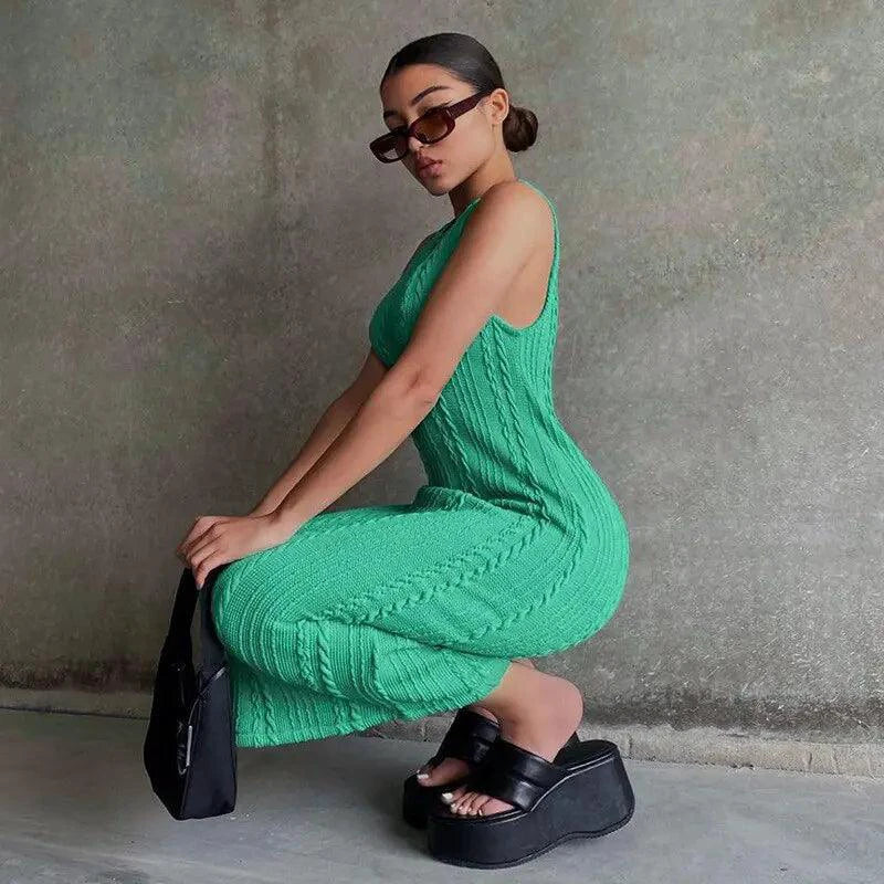 Mandotos chic knitted tank sweater dress featuring a fitted design and cozy texture, perfect for casual and stylish winter wear.
