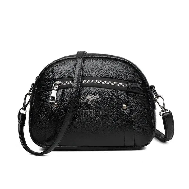 Mandotos chic leather circle purse with adjustable strap and minimalist design, perfect for casual or evening use.