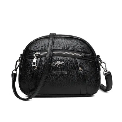 Mandotos chic leather circle purse with adjustable strap and minimalist design, perfect for casual or evening use.