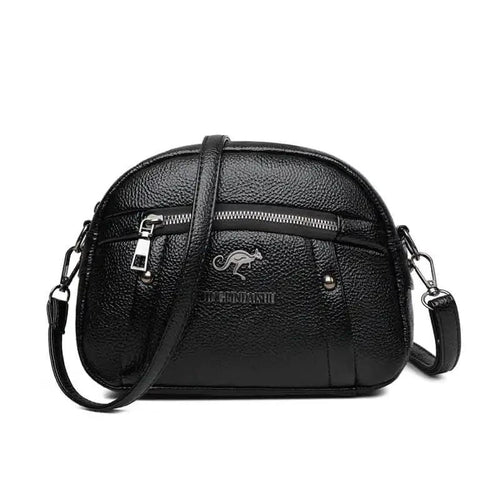 Mandotos chic leather circle purse with adjustable strap and minimalist design, perfect for casual or evening use.