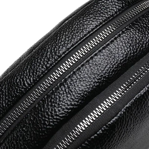 Mandotos chic leather circle purse with a sleek design and adjustable strap, perfect for stylish everyday carry.