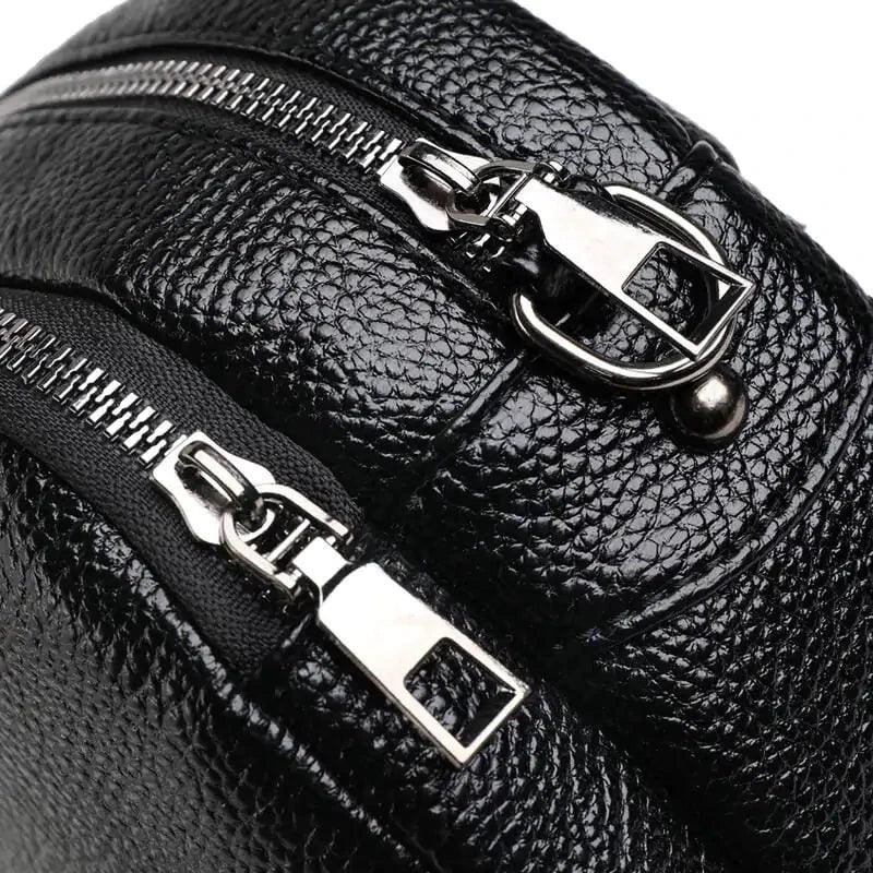 Mandotos chic leather circle purse with a sleek design, featuring a round shape and a stylish finish.
