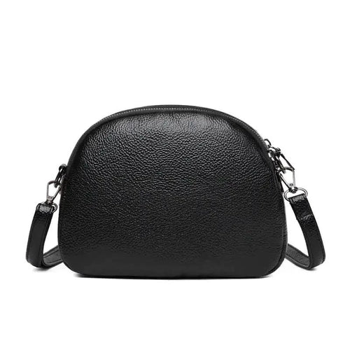 Mandotos chic leather circle purse with a sleek design and zipper closure, perfect for stylish everyday use.