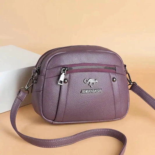 Mandotos chic leather circle purse with sleek design and top handle, perfect for stylish everyday use.