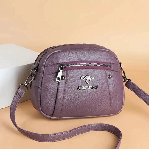 Mandotos chic leather circle purse with a sleek design and silver clasp, perfect for stylish everyday accessories.