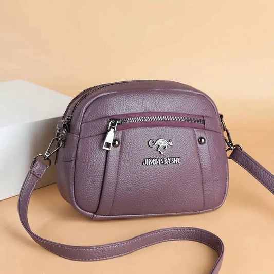 Mandotos chic leather circle purse with a sleek design and silver clasp, perfect for stylish everyday accessories.