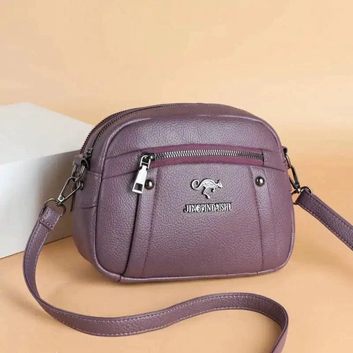 Mandotos chic leather circle purse with a sleek design, featuring a smooth leather finish and a stylish round shape.