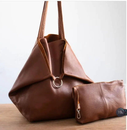 Mandotos chic leather tote handbag with sleek design, featuring sturdy handles and spacious interior for everyday use