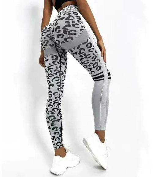 Mandotos chic leopard print high-rise yoga tights laid flat, showing the stylish design and comfortable fit.