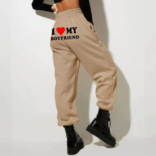 Mandotos Chic Love Print Trousers featuring a stylish heart pattern and tailored fit in lightweight fabric.
