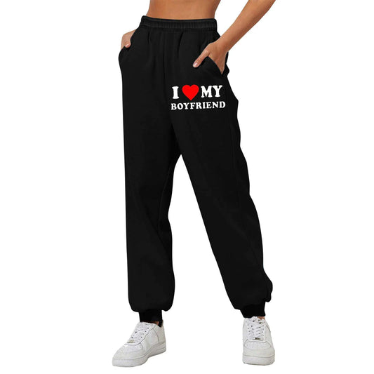 Mandotos Chic Love Print Trousers featuring a stylish love-themed pattern and tailored fit for casual or trendy outfits.