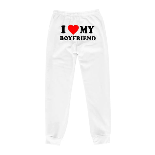Mandotos Chic Love Print Trousers featuring stylish heart patterns and a relaxed fit, perfect for casual or chic outfits.