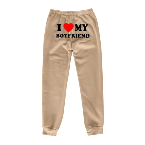 Mandotos chic love print trousers featuring a stylish, vibrant pattern and tailored fit for a fashionable look.