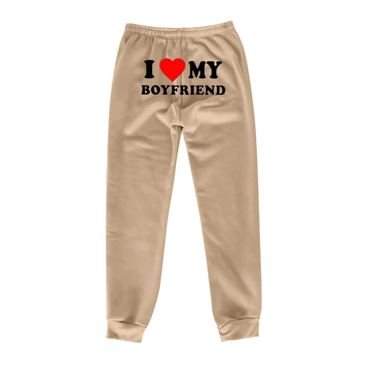 Mandotos Chic Love Print Trousers featuring a stylish heart pattern, tailored fit, and comfortable fabric for everyday wear.