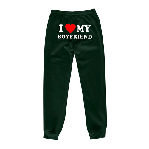 Mandotos Chic Love Print Trousers featuring a stylish heart pattern, slim fit design, and comfortable fabric for casual wear.