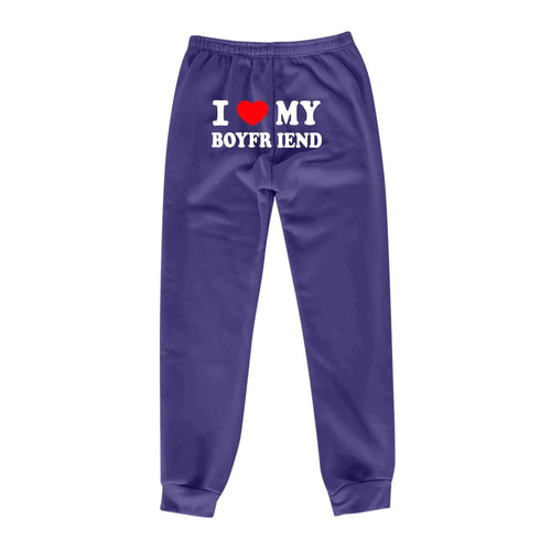 Mandotos Chic Love Print Trousers featuring stylish love-themed pattern, slim fit design, and comfortable fabric for casual wear.