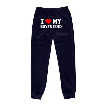 Mandotos chic love print trousers featuring a stylish pattern, tailored fit, and comfortable fabric for casual or dressy wear