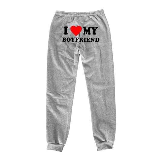 Mandotos Chic Love Print Trousers featuring stylish heart patterns and a comfortable fit, perfect for casual or chic outfits.