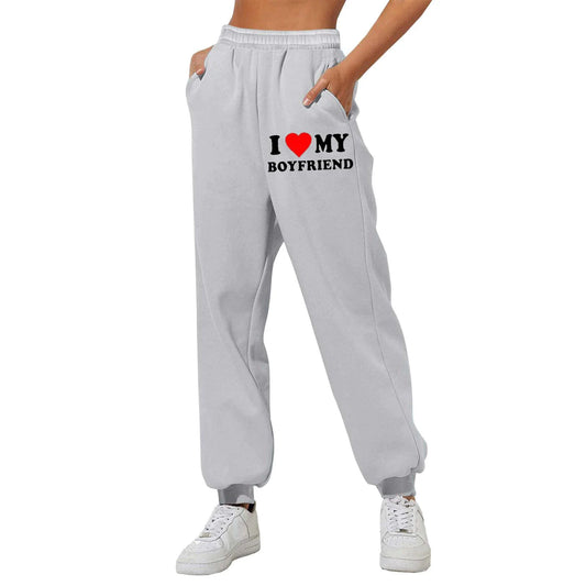 Mandotos Chic Love Print Trousers featuring stylish heart patterns and a comfortable fit, perfect for casual or chic outfits.