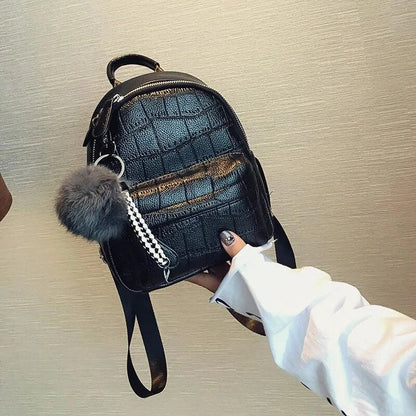 Mandotos Chic Mini Leather Backpack with adjustable straps and gold-tone hardware, perfect for casual or stylish outings.