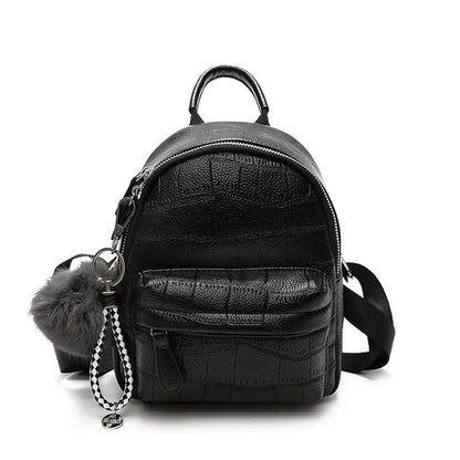 Mandotos chic mini leather backpack with adjustable straps and gold-tone hardware, stylish for everyday use.