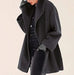 Mandotos chic multi-shade oversized cardigan featuring a relaxed fit and vibrant color blocks, displayed on a model.