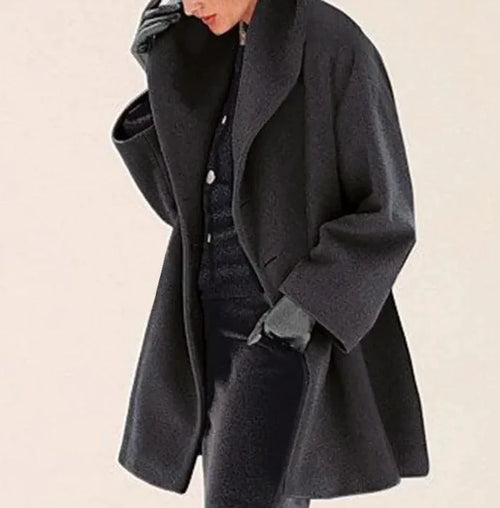 Mandotos chic multi-shade oversized cardigan featuring a relaxed fit and vibrant color blocks, displayed on a model.