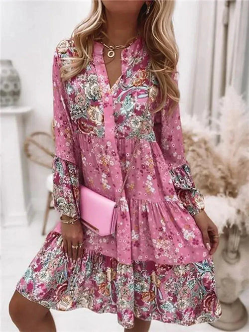 Mandotos chic pleated long sleeve dress with a flowing silhouette and elegant design, perfect for stylish occasions.