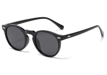 Mandotos chic round UV-block sunglasses with black frames and dark lenses, stylish and protective for sunny days.