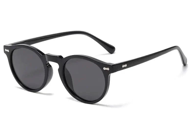 Mandotos chic round UV-block sunglasses with black frames and dark lenses, stylish and protective for sunny days.