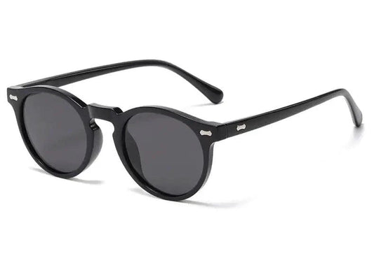 Mandotos chic round UV-block sunglasses with black frames and dark lenses, stylish and protective for sunny days.