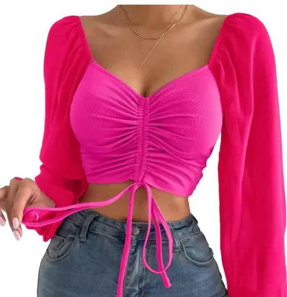 Mandotos chic V-neck crop top with balloon sleeves, lightweight fabric, and stylish design for casual or trendy outfits.