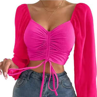 Mandotos chic V-neck balloon sleeve crop top worn by a model, featuring a stylish fit and trendy design.