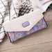 Mandotos women's leather clutch wallet with card holder, featuring a sleek, stylish design in black leather.
